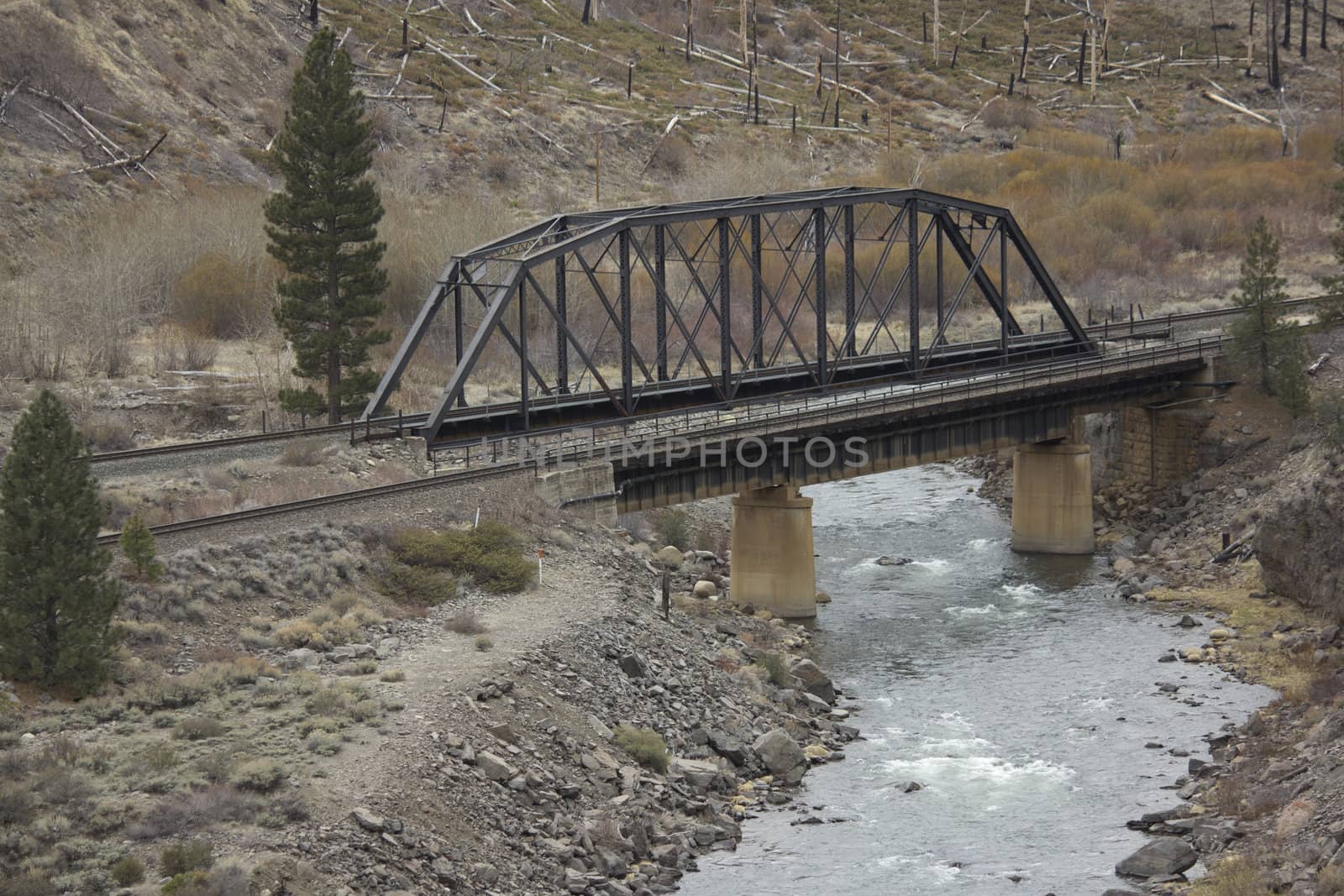 Railroad bridge over the Truckee rever in California by jeremywhat