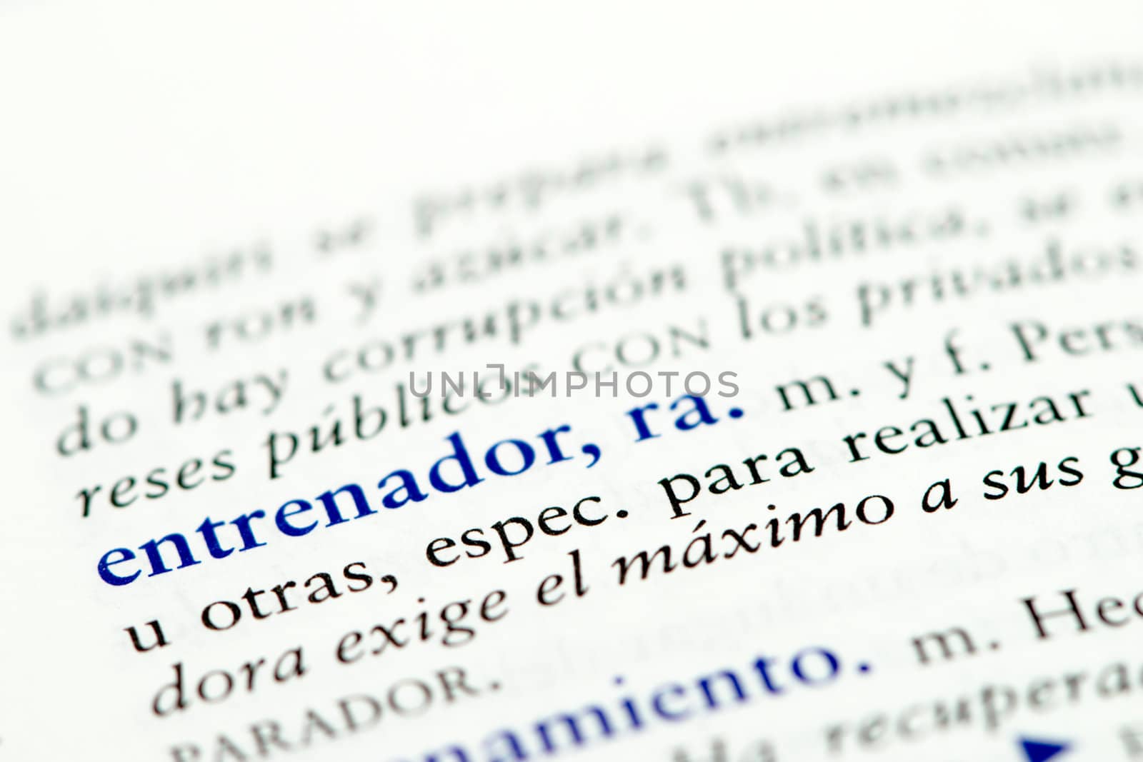 Closeup of Spanish dictionary word for coach