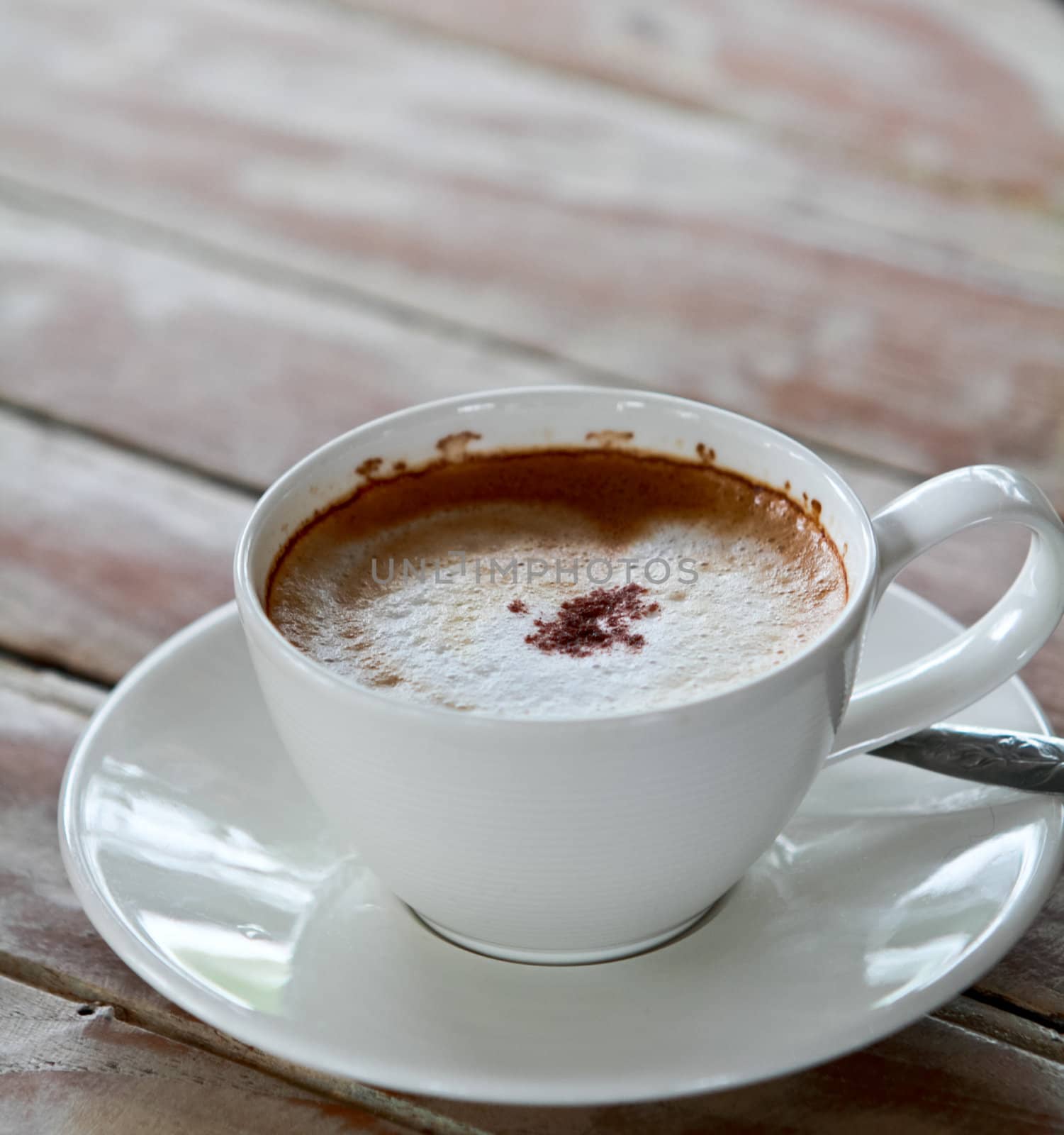 Coffee cup on wooden table