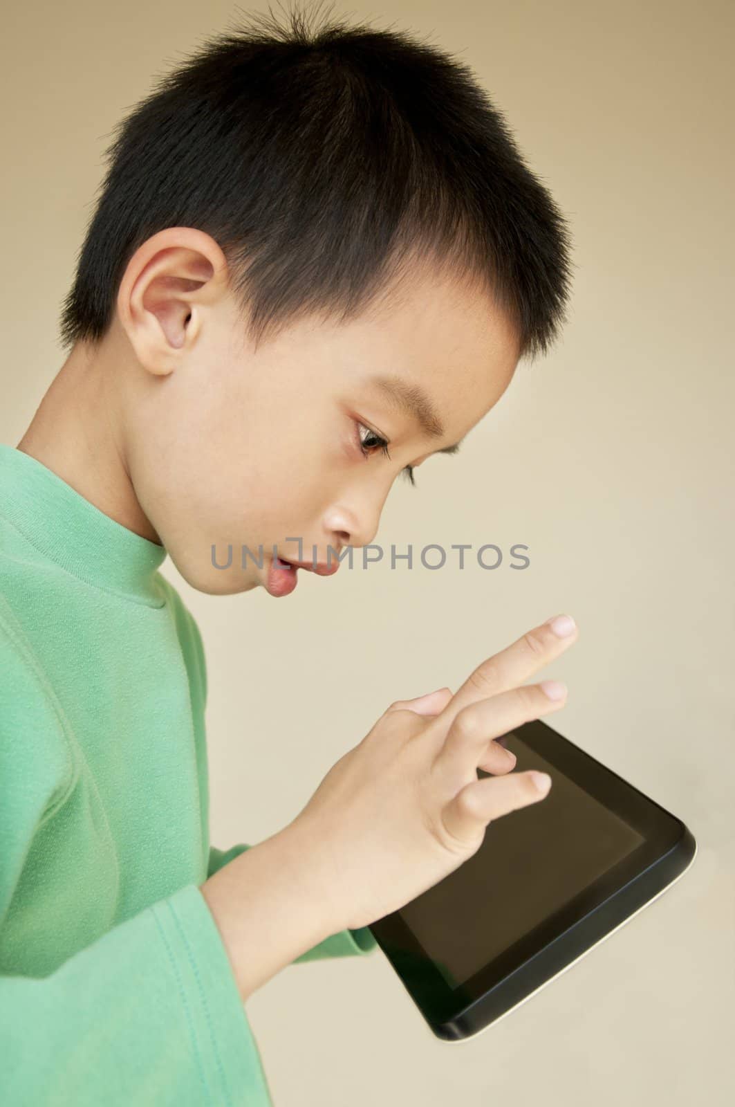 The young boy is being used to touch-pad