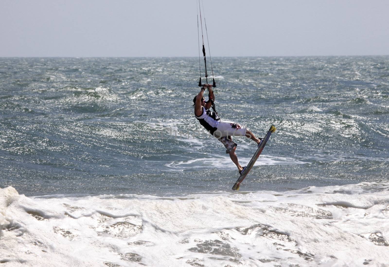 Kiteboarder enjoy surfing in ocean. Vietnam