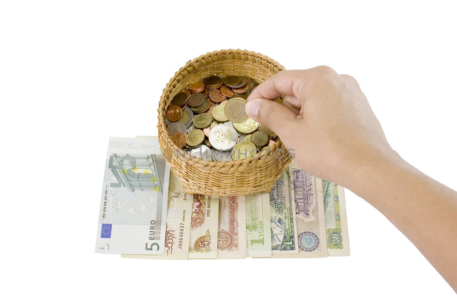Money is put by hand in to the basket save money concept.