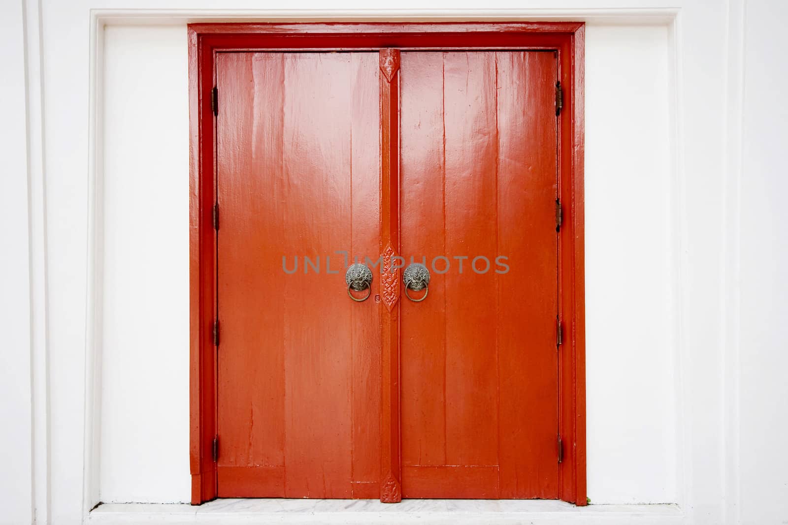 Old thai door with single traditional asian red wooden door closed