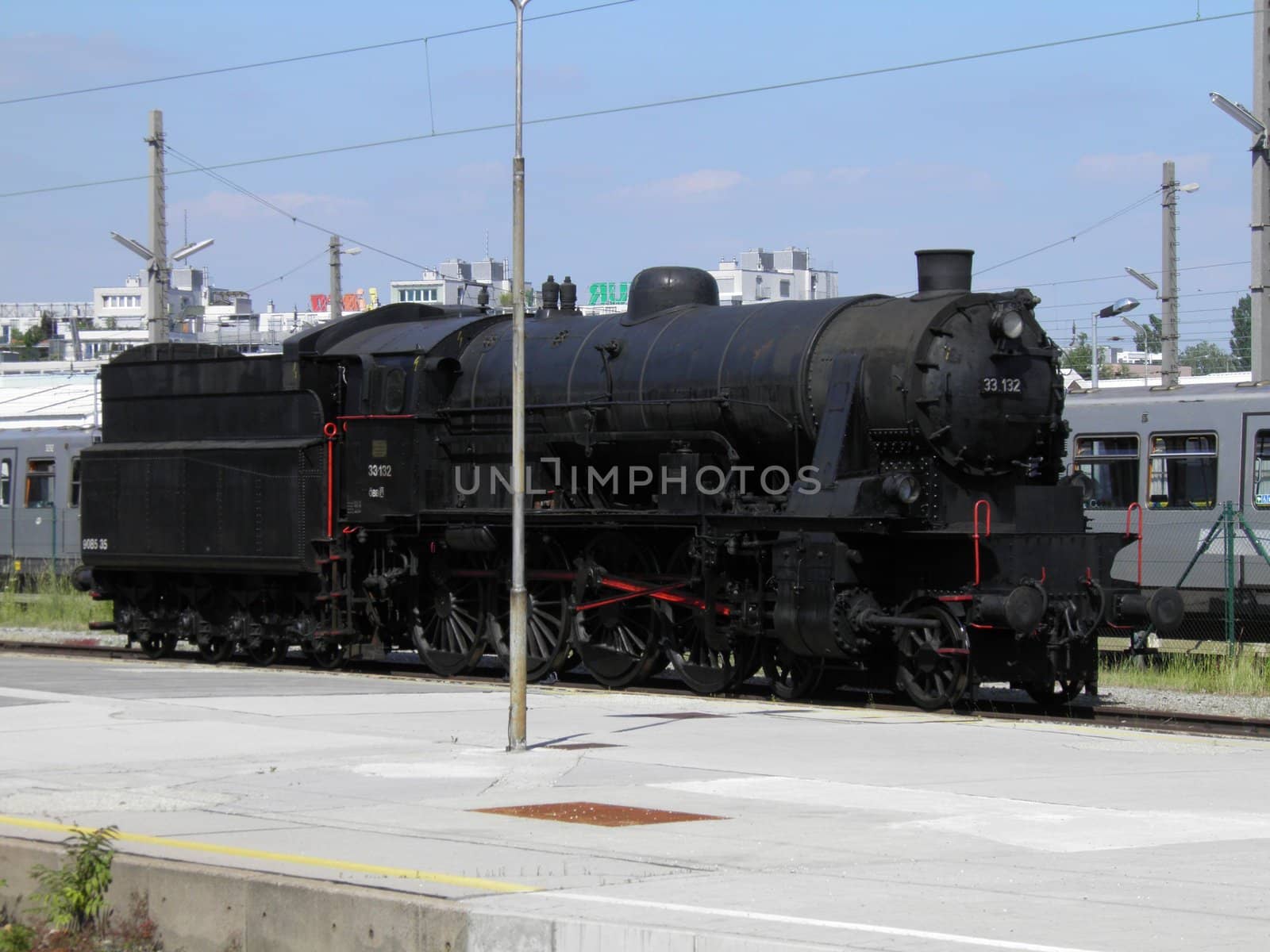 Steam engine train locomotive in a station