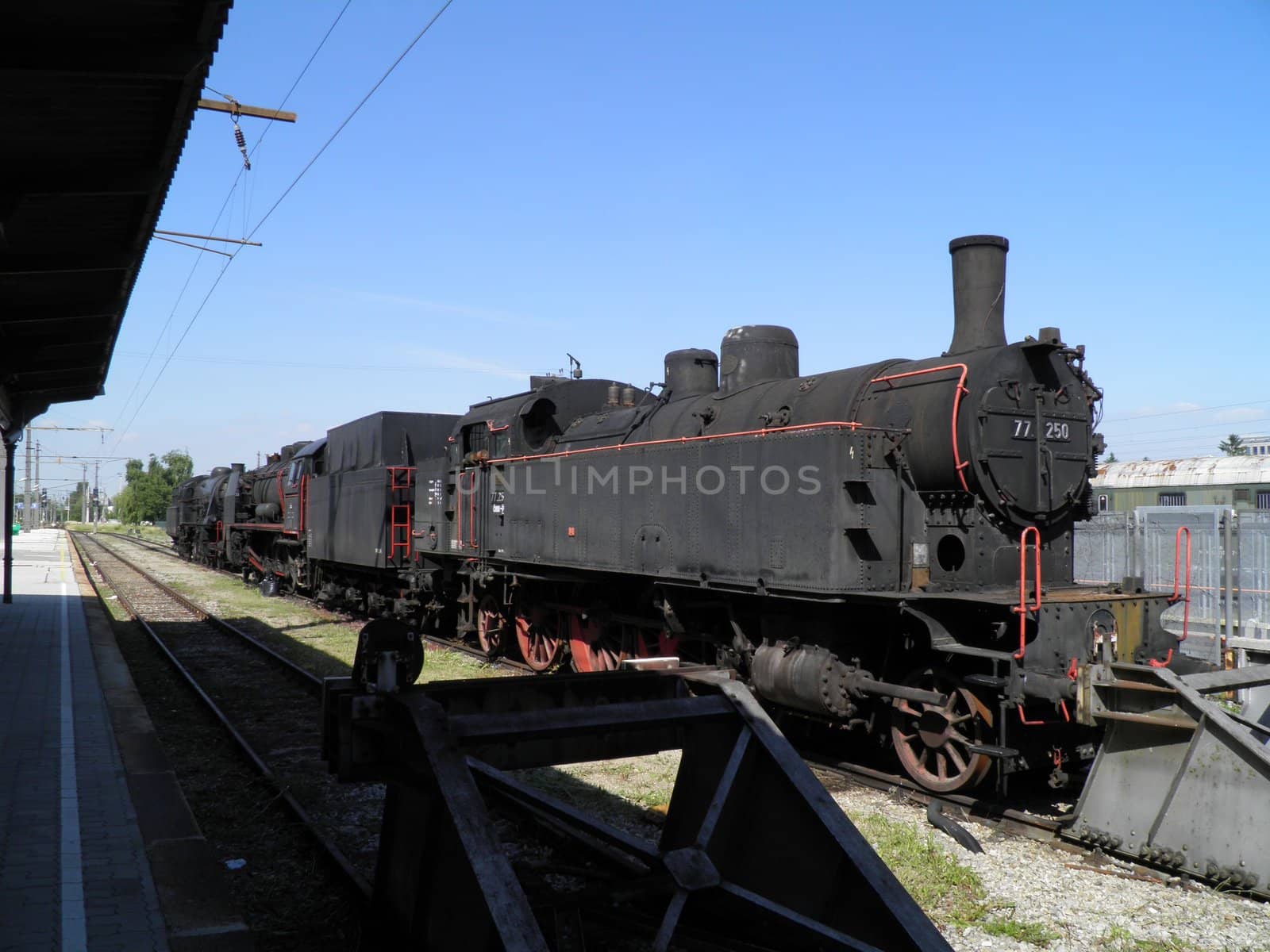 Steam engine train locomotive in a station