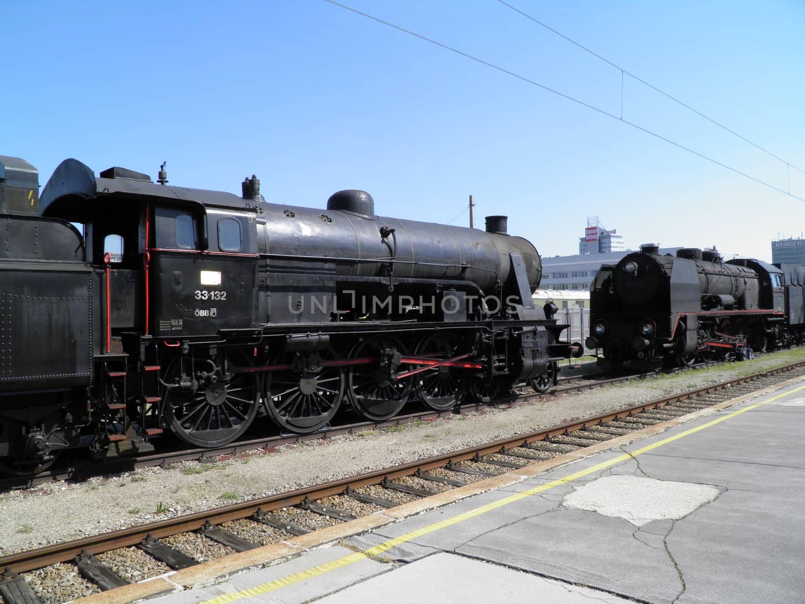 Steam engine train locomotive in a station