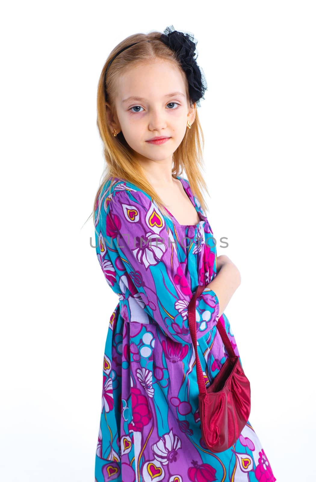 Young an elegant girl model in colorful dress. Isolated on white background