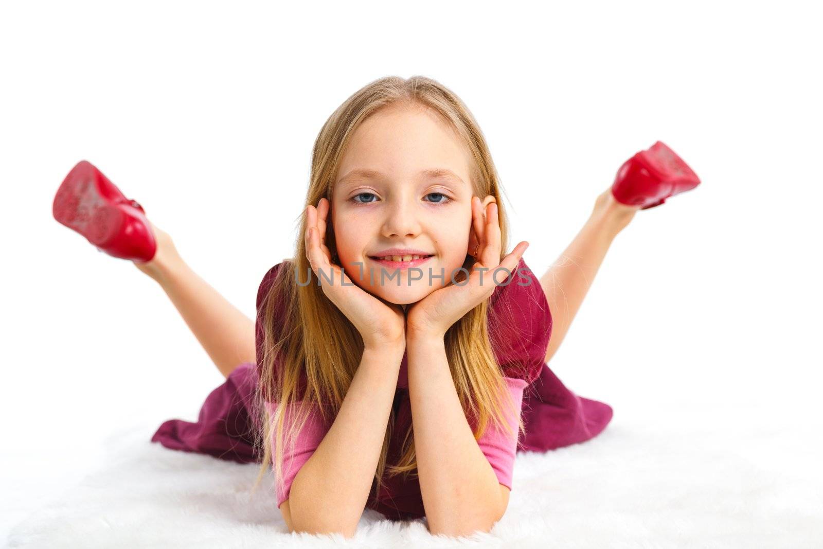 Happy girl lying on floor, isolated on white