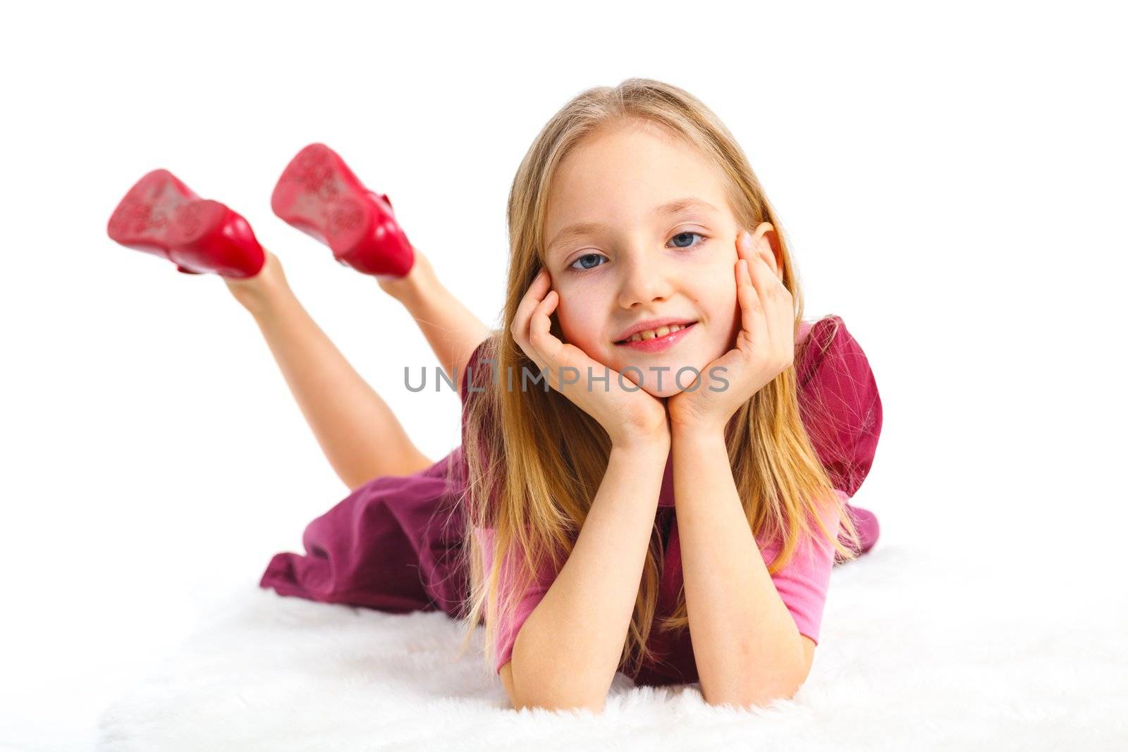 Happy girl lying on floor, isolated on white