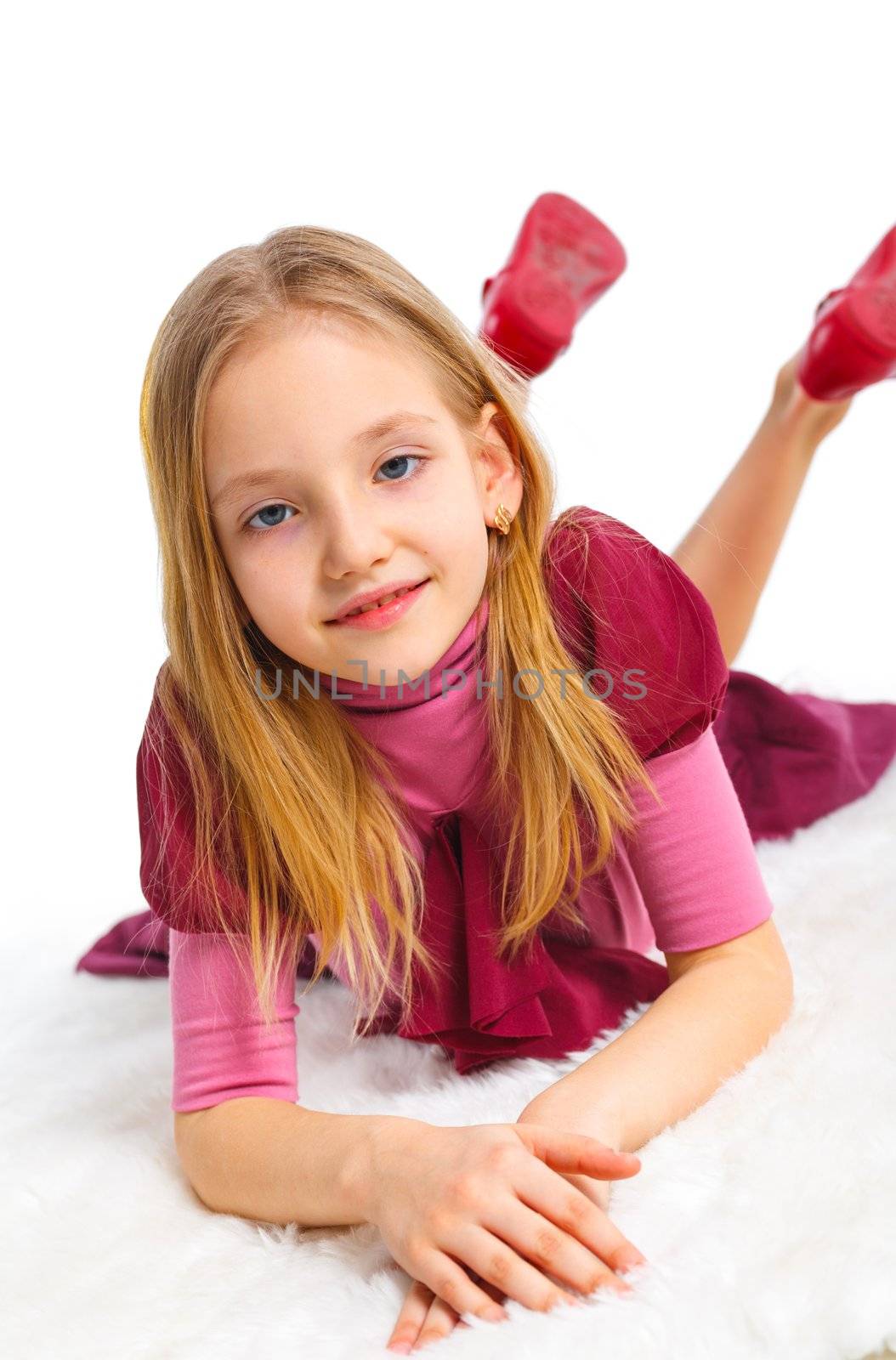 Happy girl lying on floor, isolated on white. Vertical view