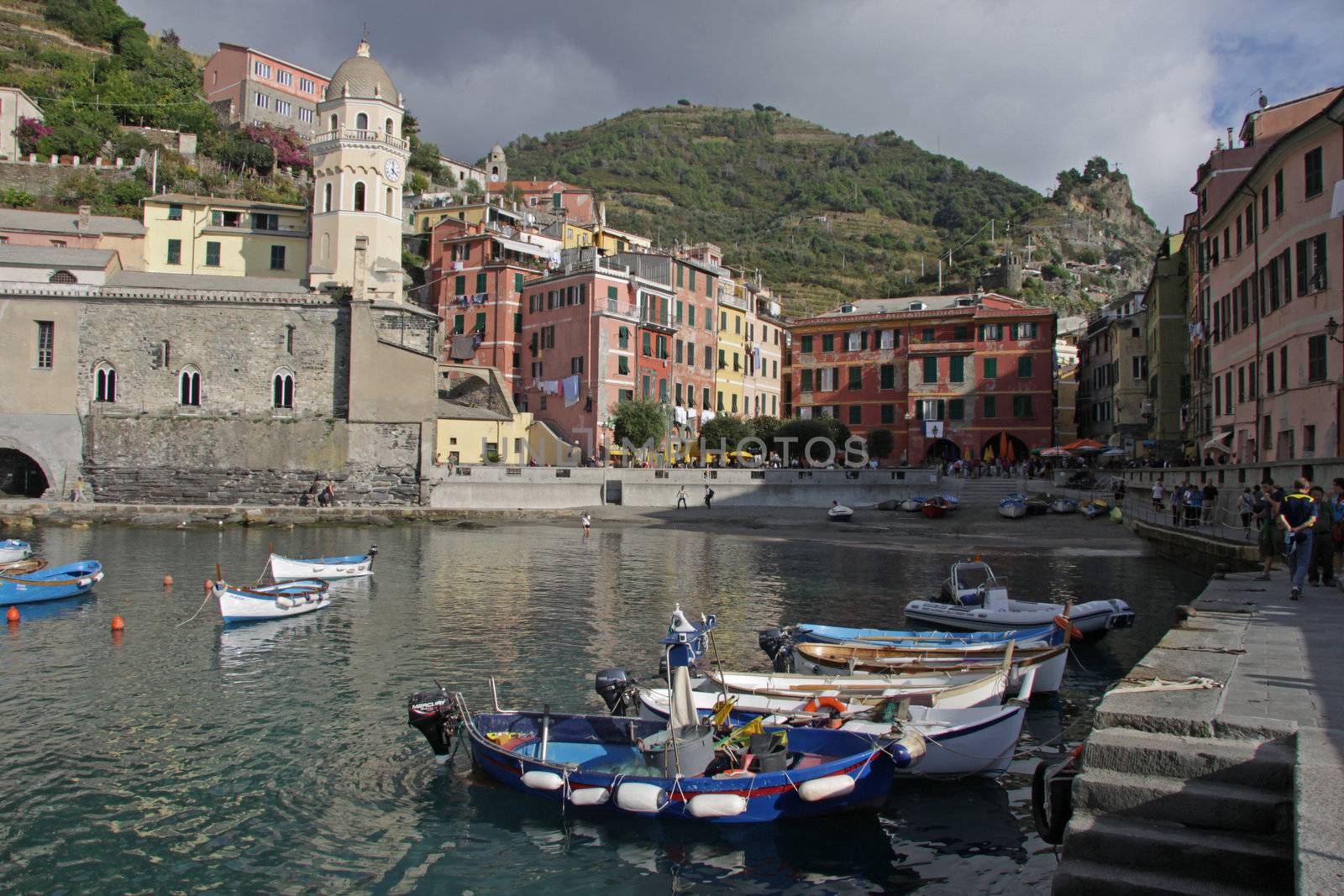 Fishing boats moored in the harbor of Vernazza.  Vernazza is one of the five villages that make up Cinque Terre.  Located on the rugged coast of the Italian Riviera in the Liguria region of Italy.
