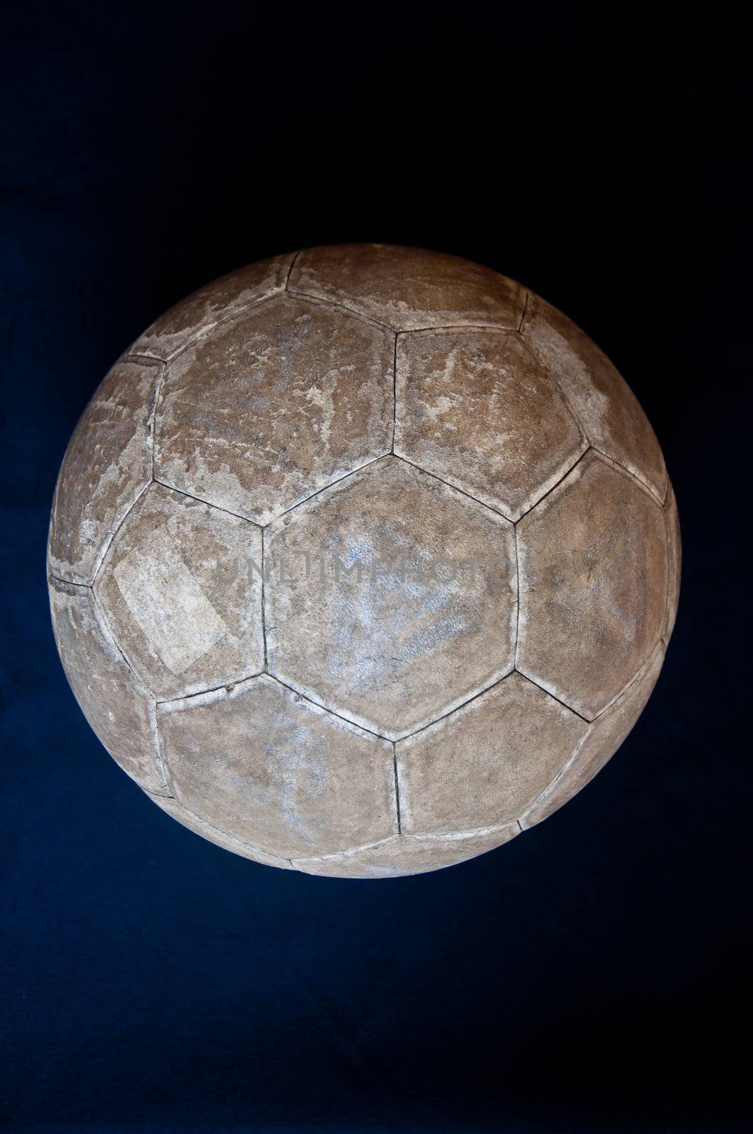 old football on black background