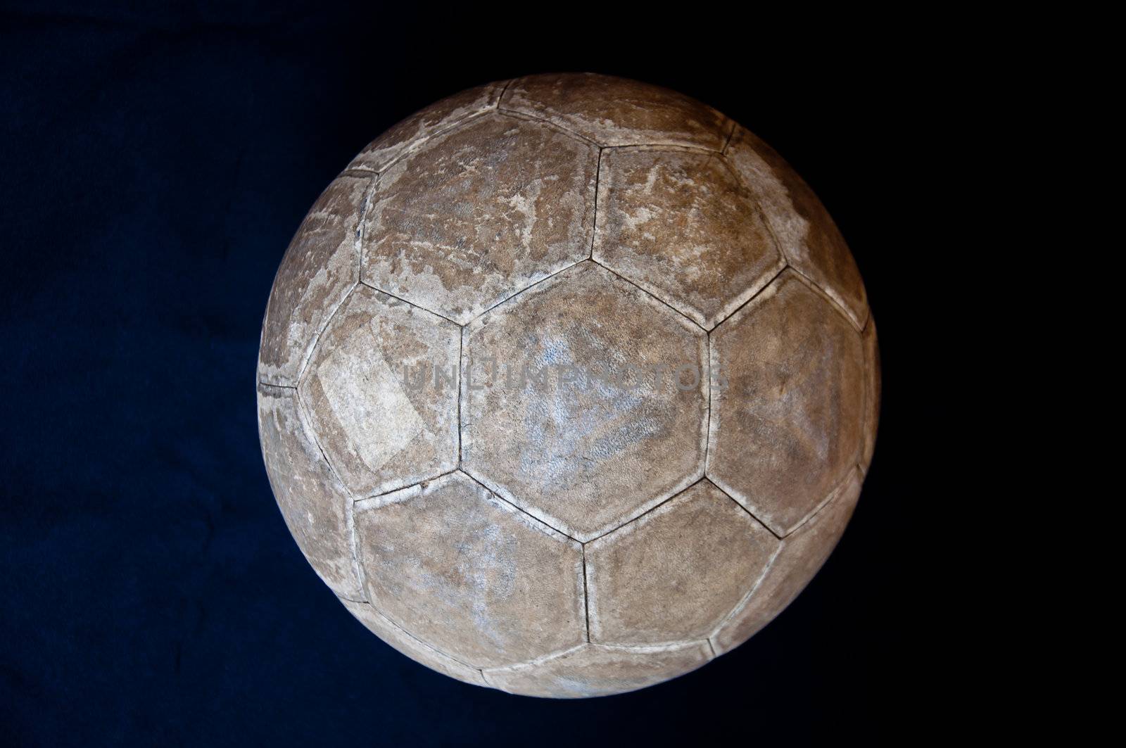 old football on black background