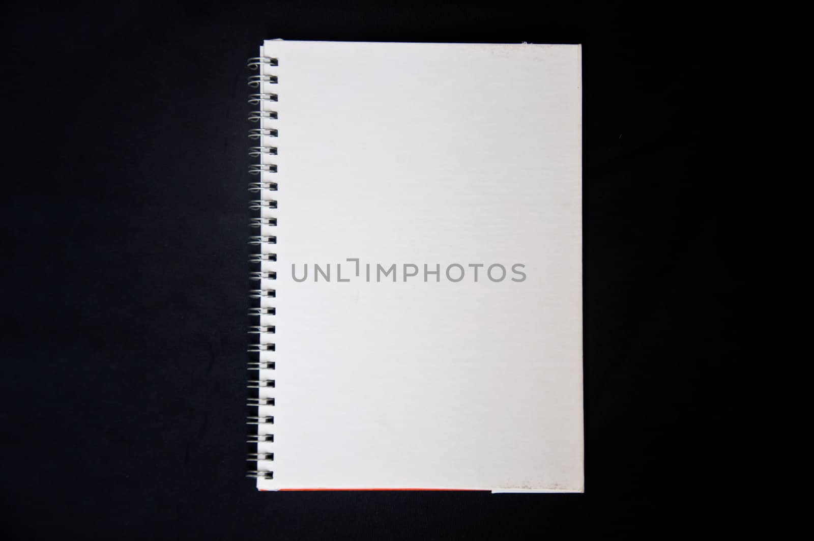 white notebook on black background