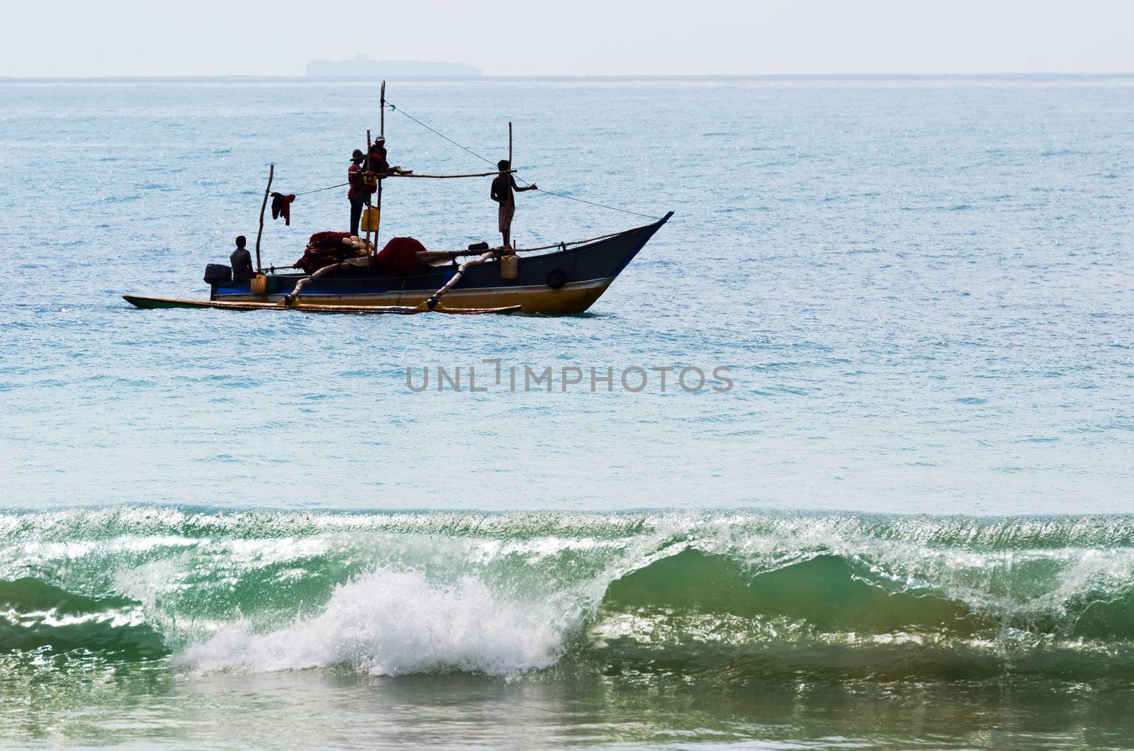 Traditional Asian fishing in small boat by iryna_rasko