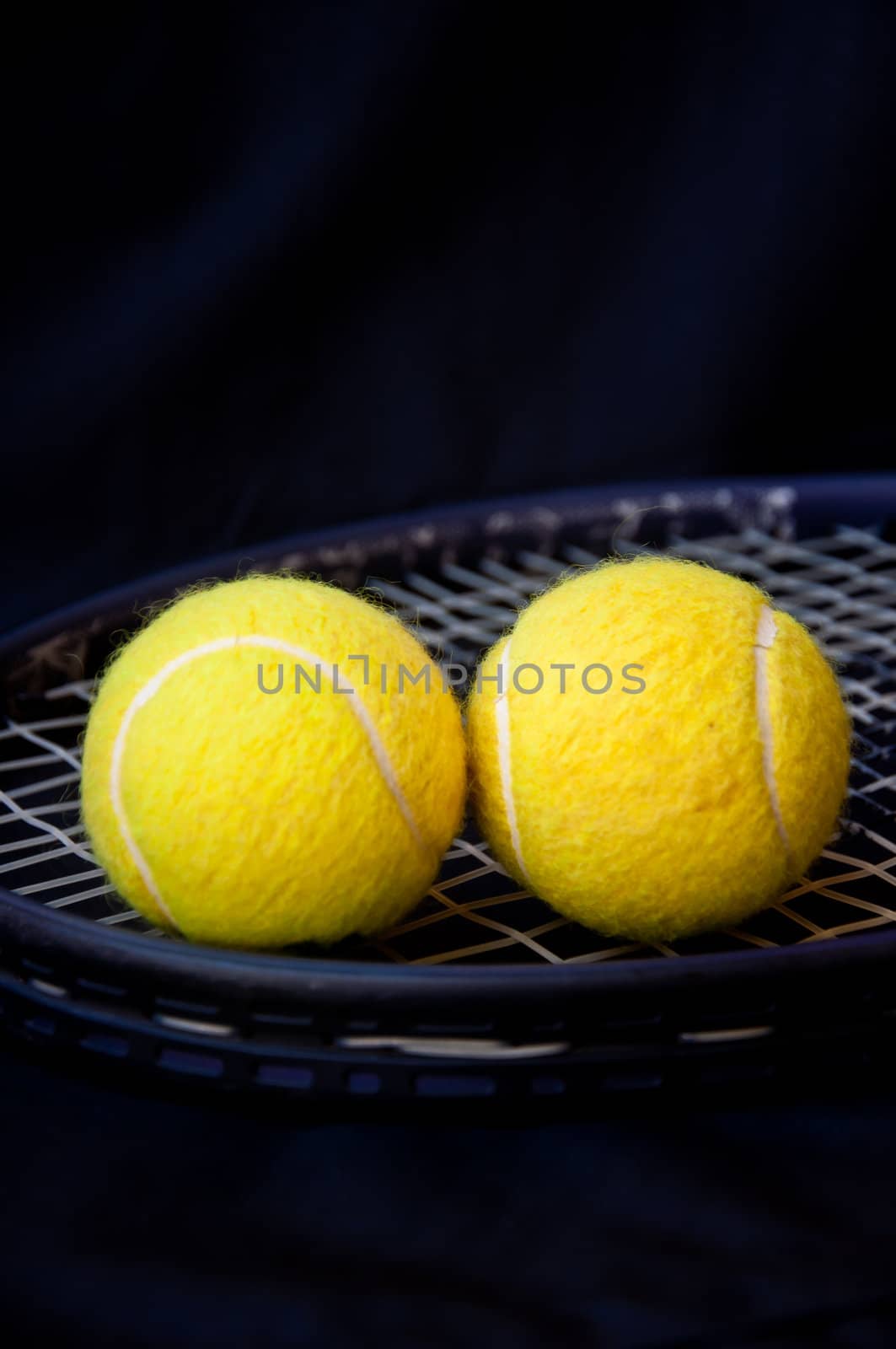 tennis ball on racket