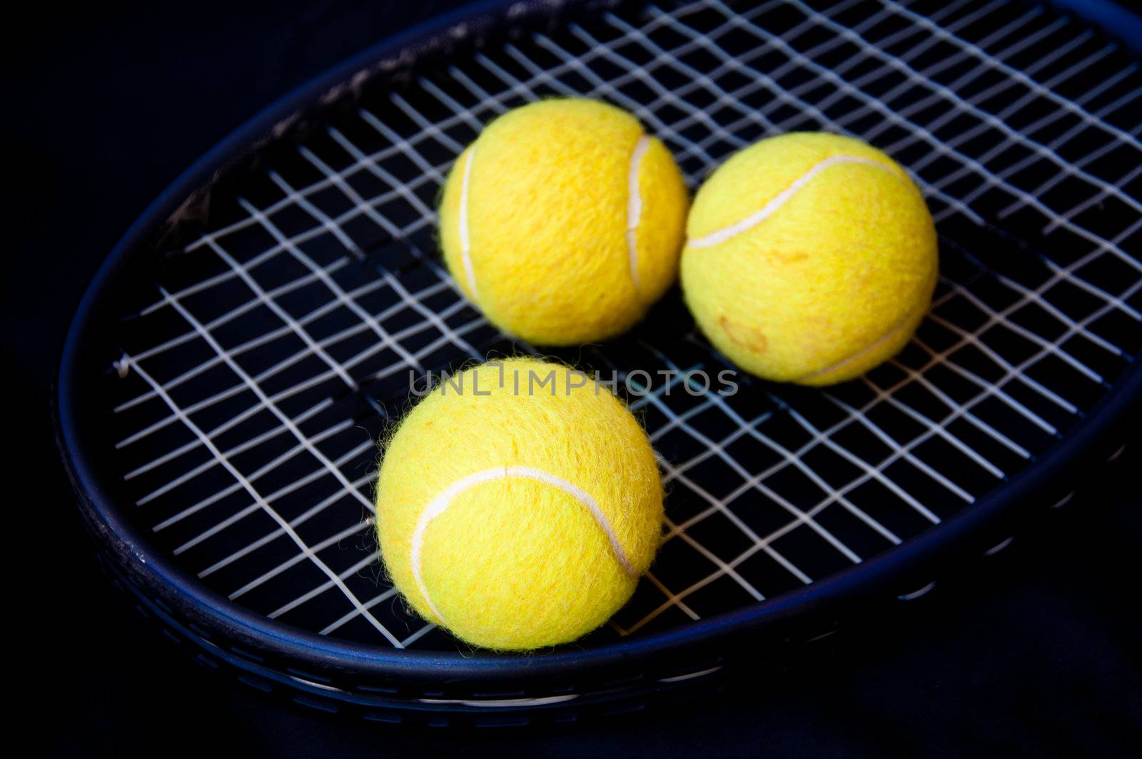 tennis ball on racket