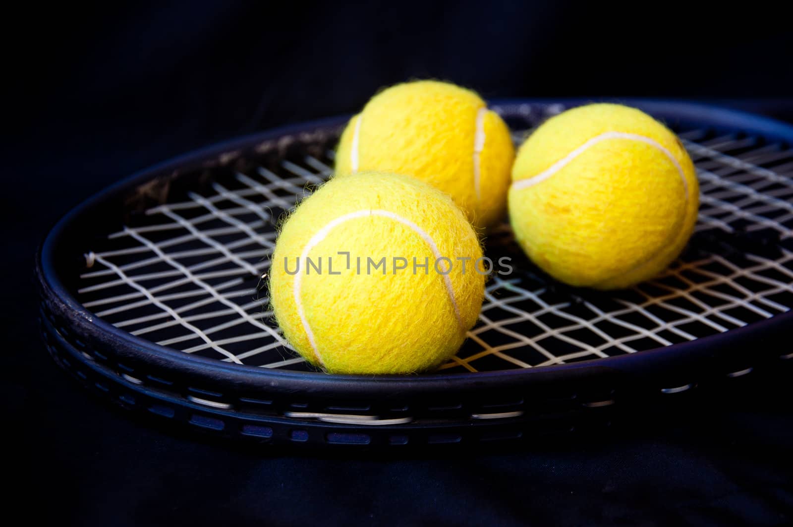 tennis ball on racket