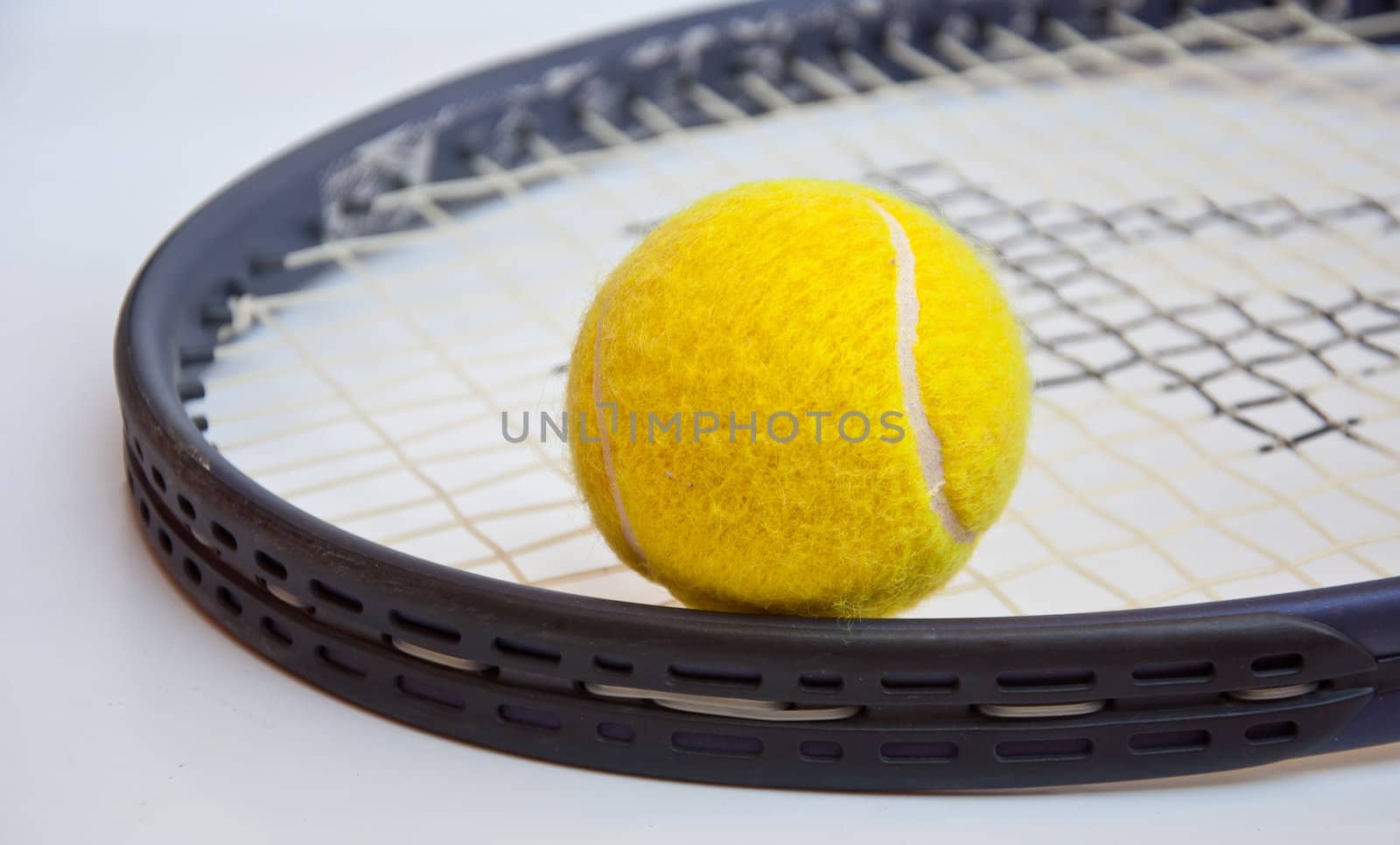 tennis ball on racket