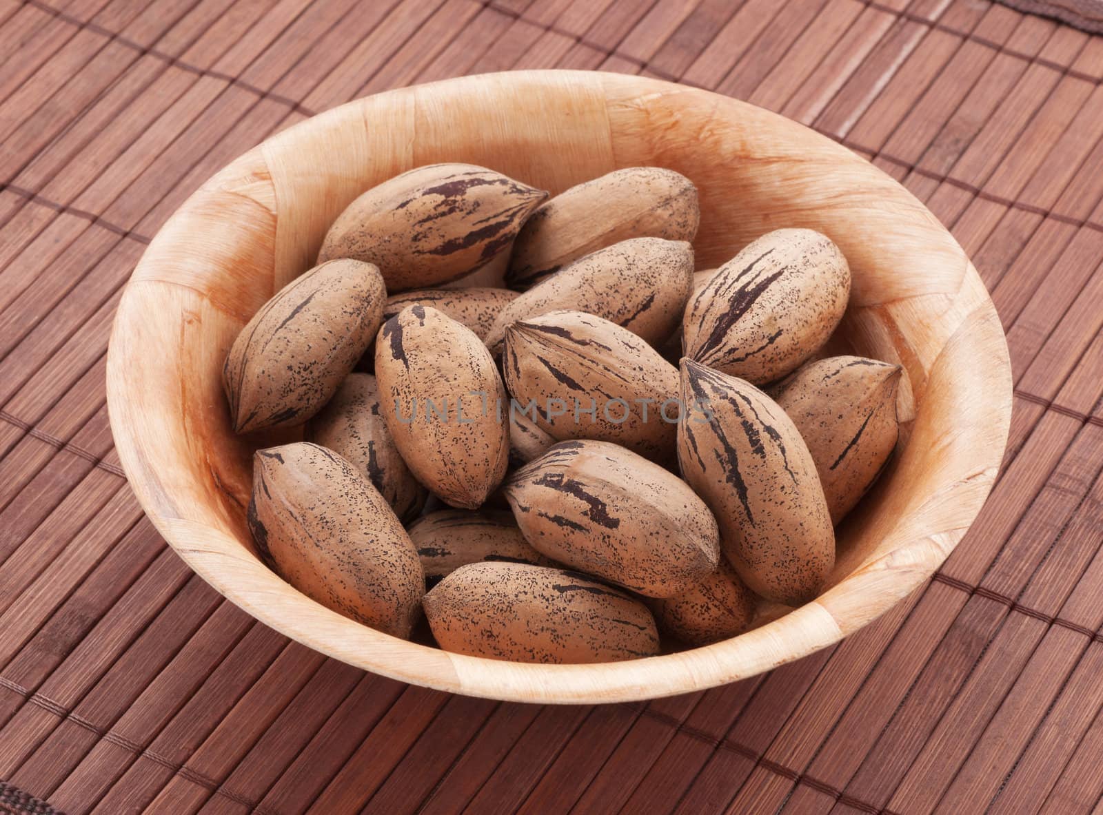 Bowl of pecan nuts, close up shot. 