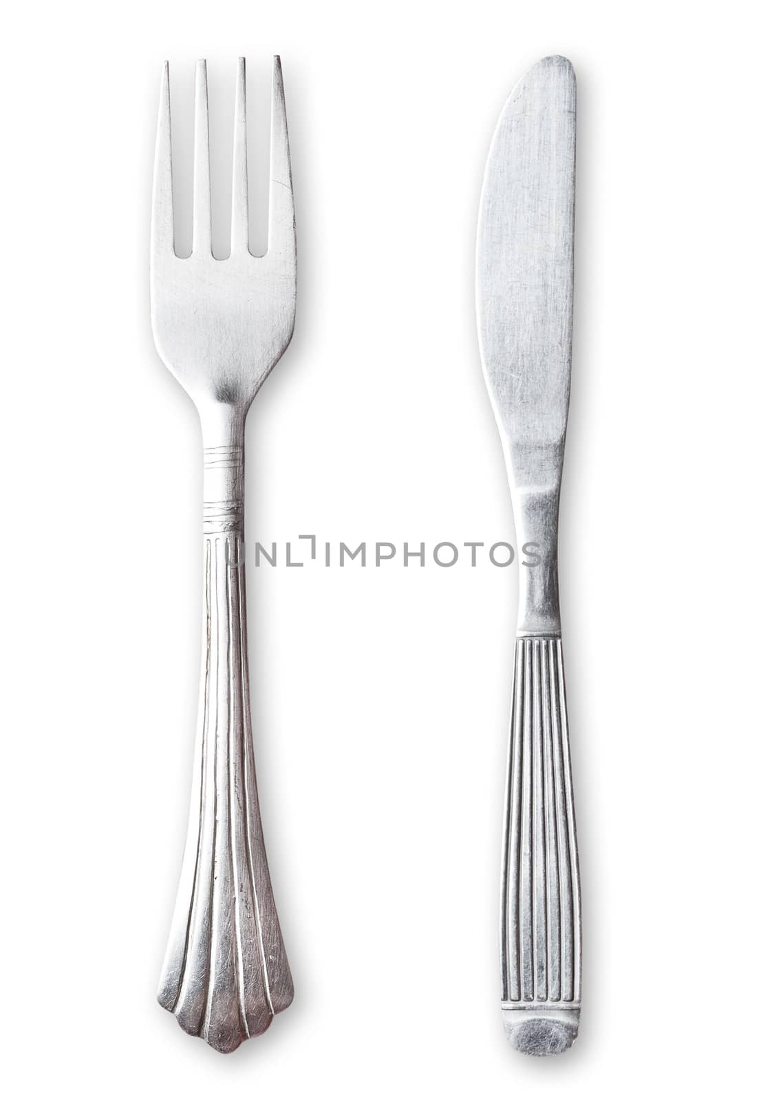 Fork and knife on white background. Clipping path excludes the shadow.