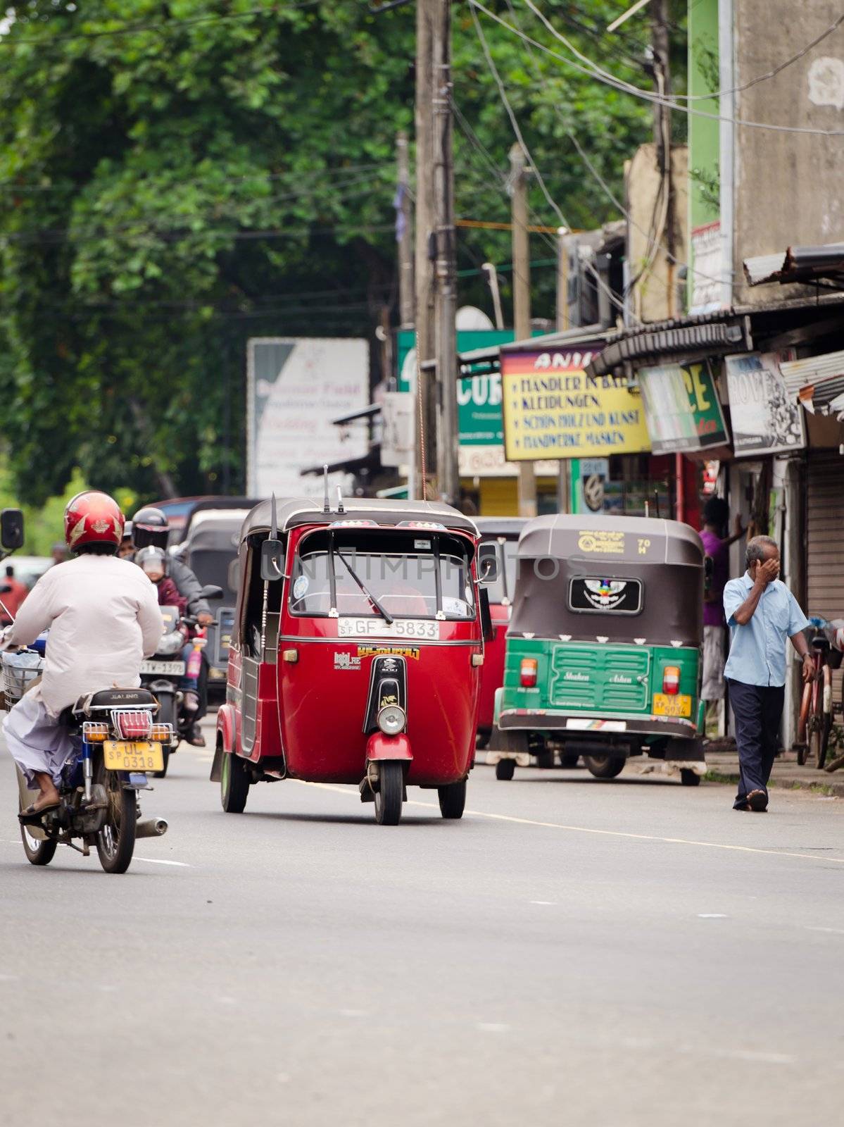Bendota, Sri Lanka - December 14, 2011: Tuk-tuk and motobikes are the most popular  transport types on Asian streets.  .