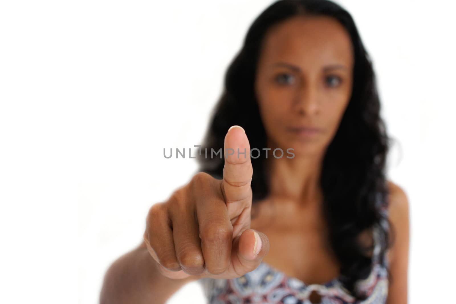 Young latin woman pointing with a finger in the air. 