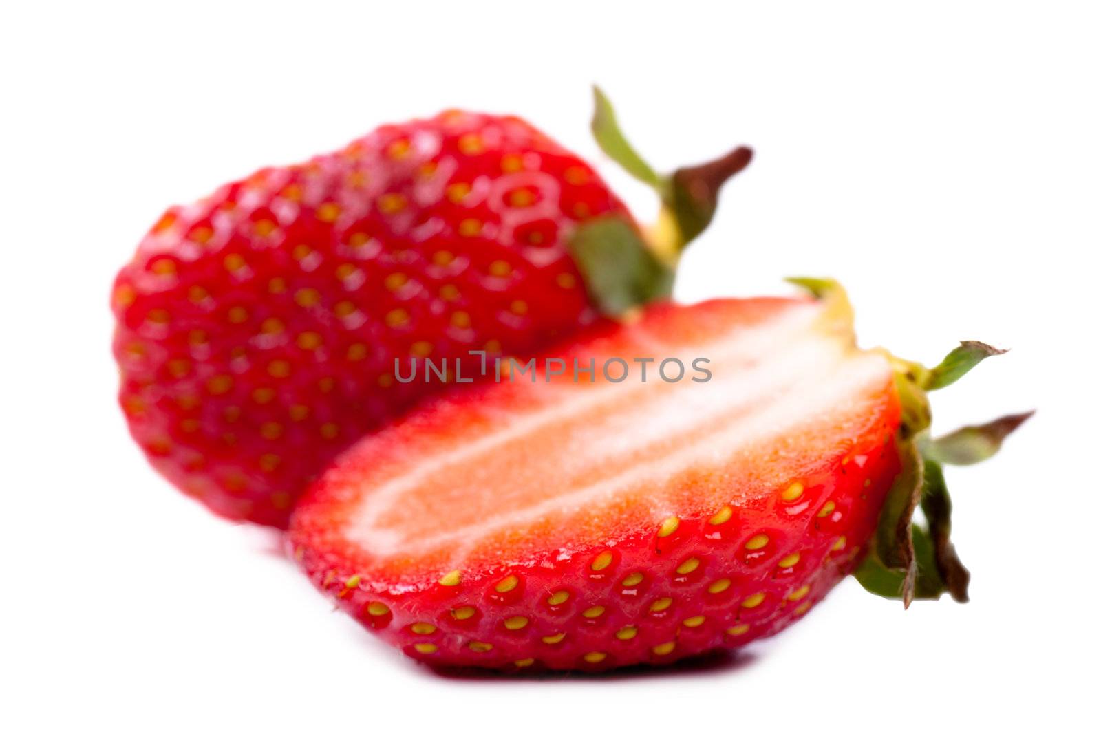 Macro view of a fresh strawberry over white background