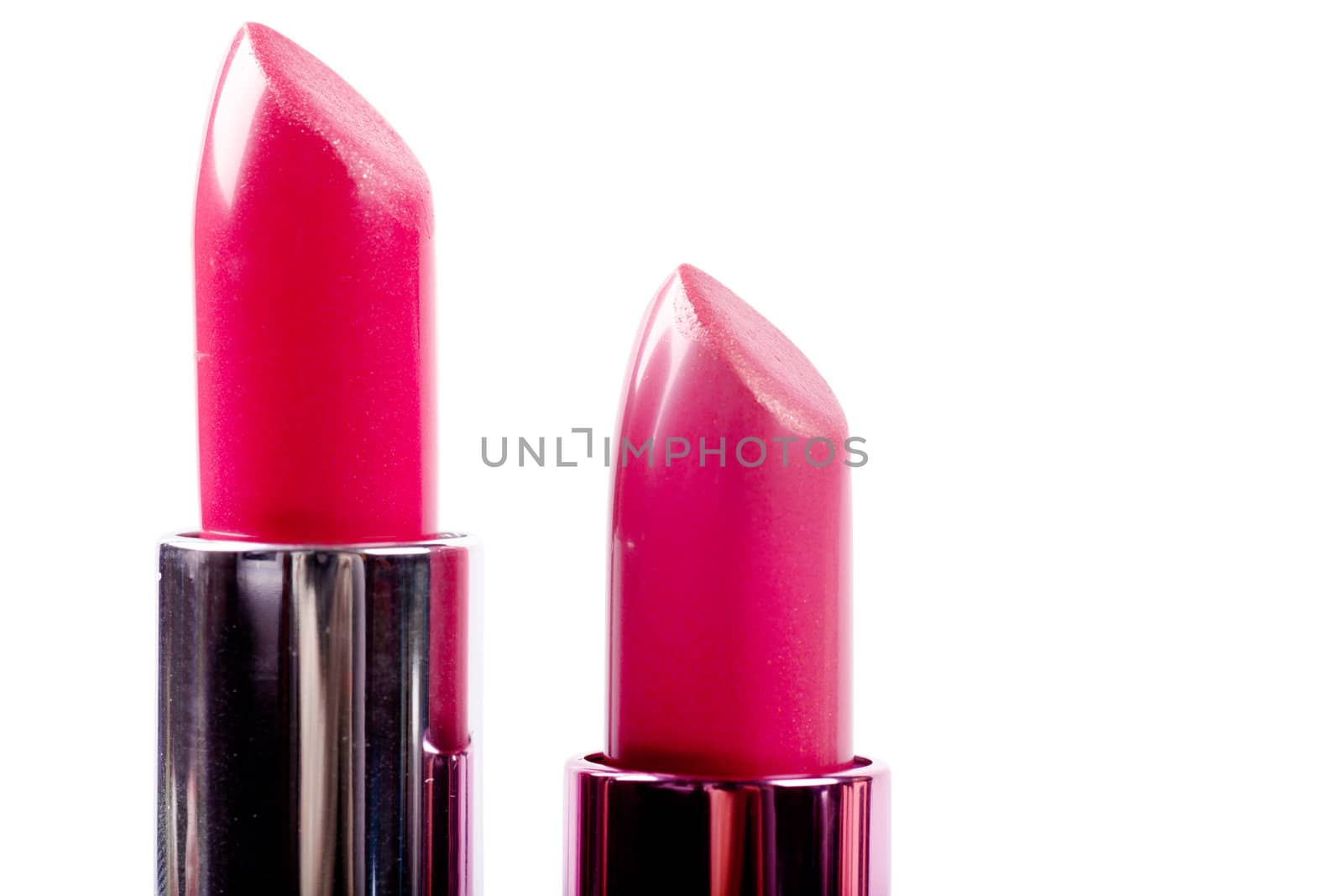 Red lipsticks isolated over white background