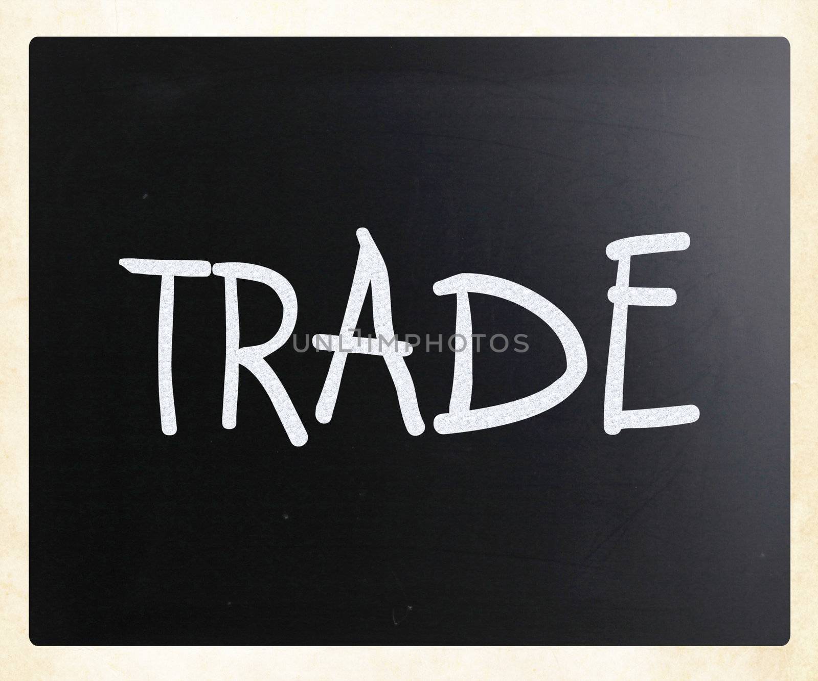 "Trade" handwritten with white chalk on a blackboard