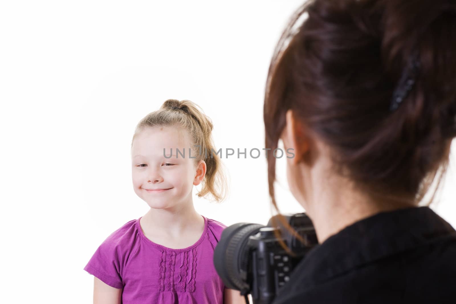 girl having her photo taken by photographer