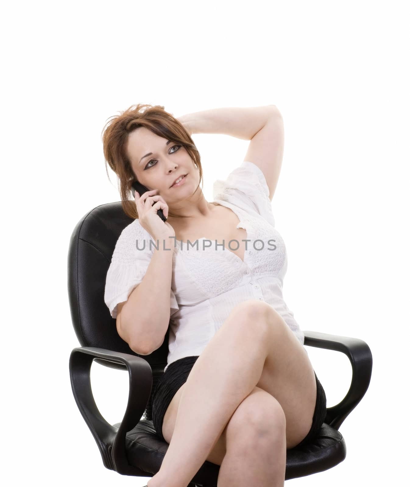 woman sitting in office chair talking on phone