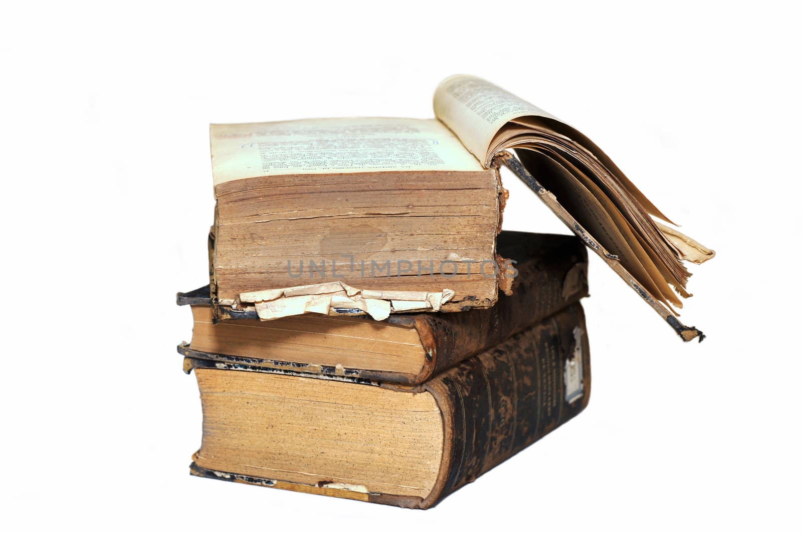 Stack of three old books to show the wear of age. Isolated on white background.