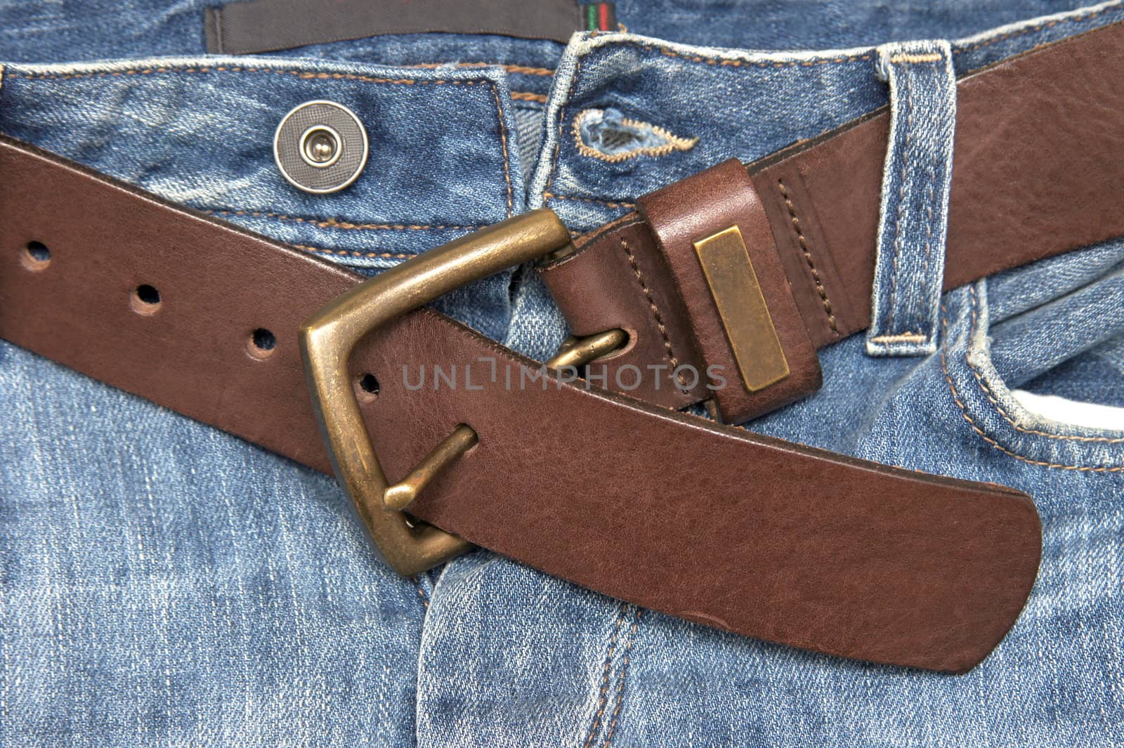 Leather belt in a blue jeans