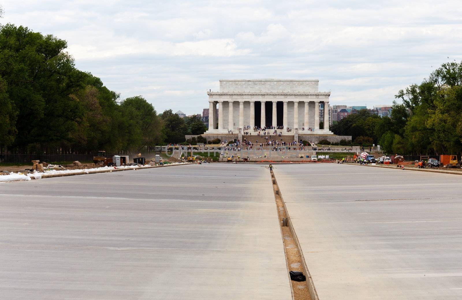 WASHINGTON DC - APRIL 17: Constructing new concrete floor of  reflecting pool in front of Lincoln Memorial in Washington DC. The project will cost $30.7M.