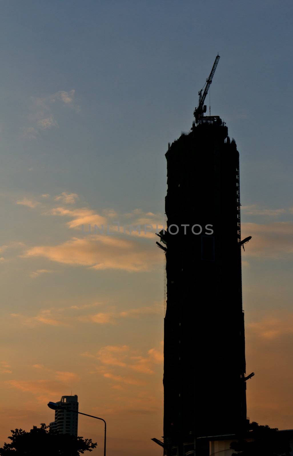 Construction building crane with silhouette by stoonn