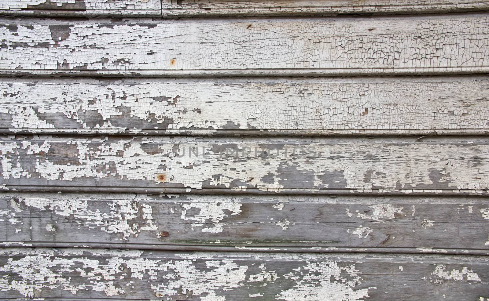 Picture of a wall textuer where paint has fallen off