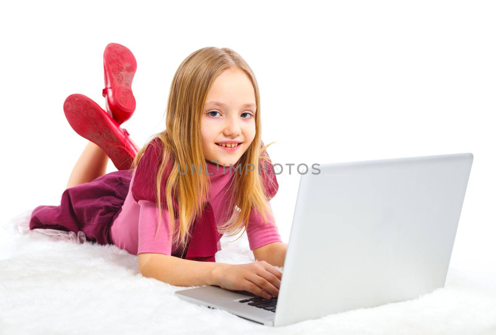 Attractive young girl using notebook computer. Isolated on white background.