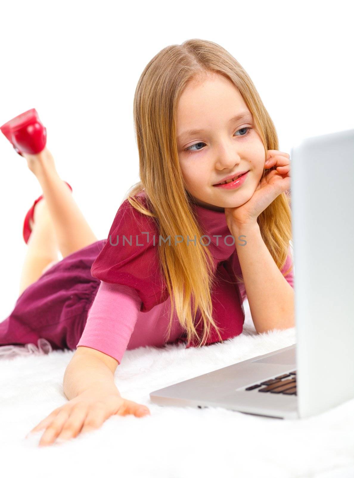 Attractive young girl using notebook computer. Isolated on white background.