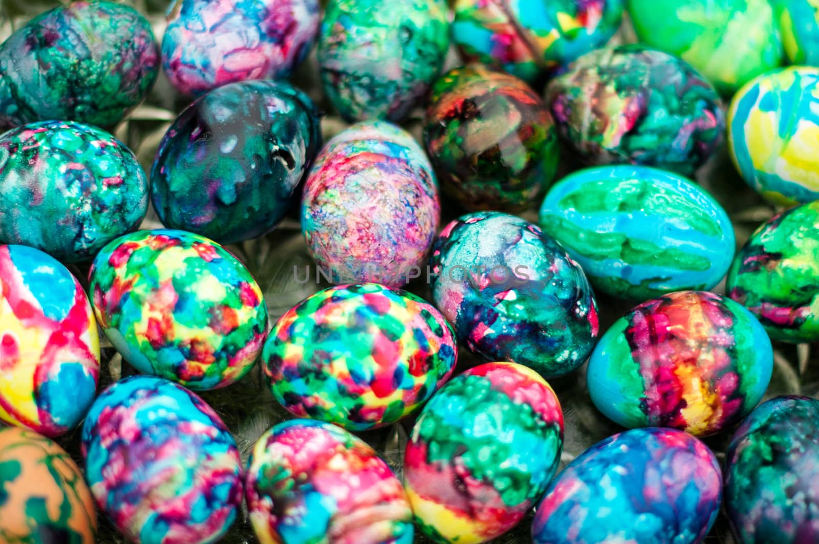 Close-up of multi-coloured easter eggs on a tray