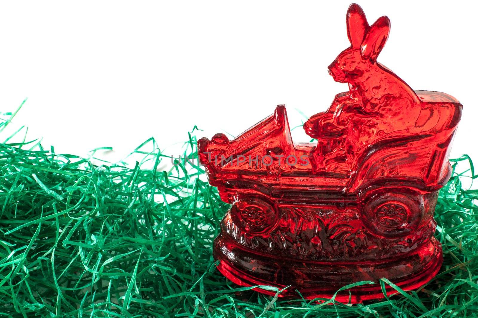 Sugar Easter bunny with car on grass with copy space