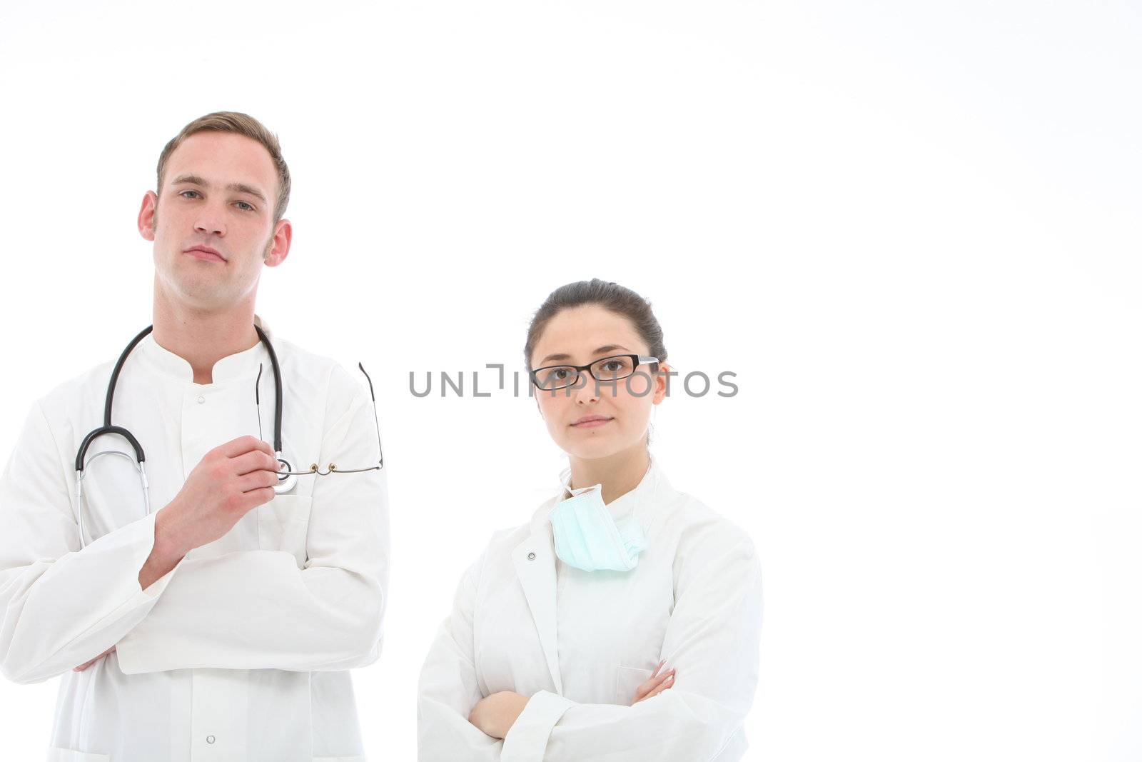 Young doctor with stethoscope around his neck, and his female assistant on white background with copy space