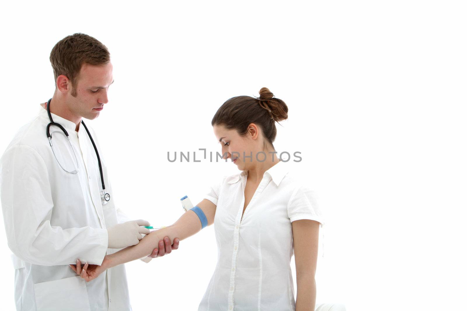 Doctor giving intravenous injection in the arm of a female patient or colleague isolated on white