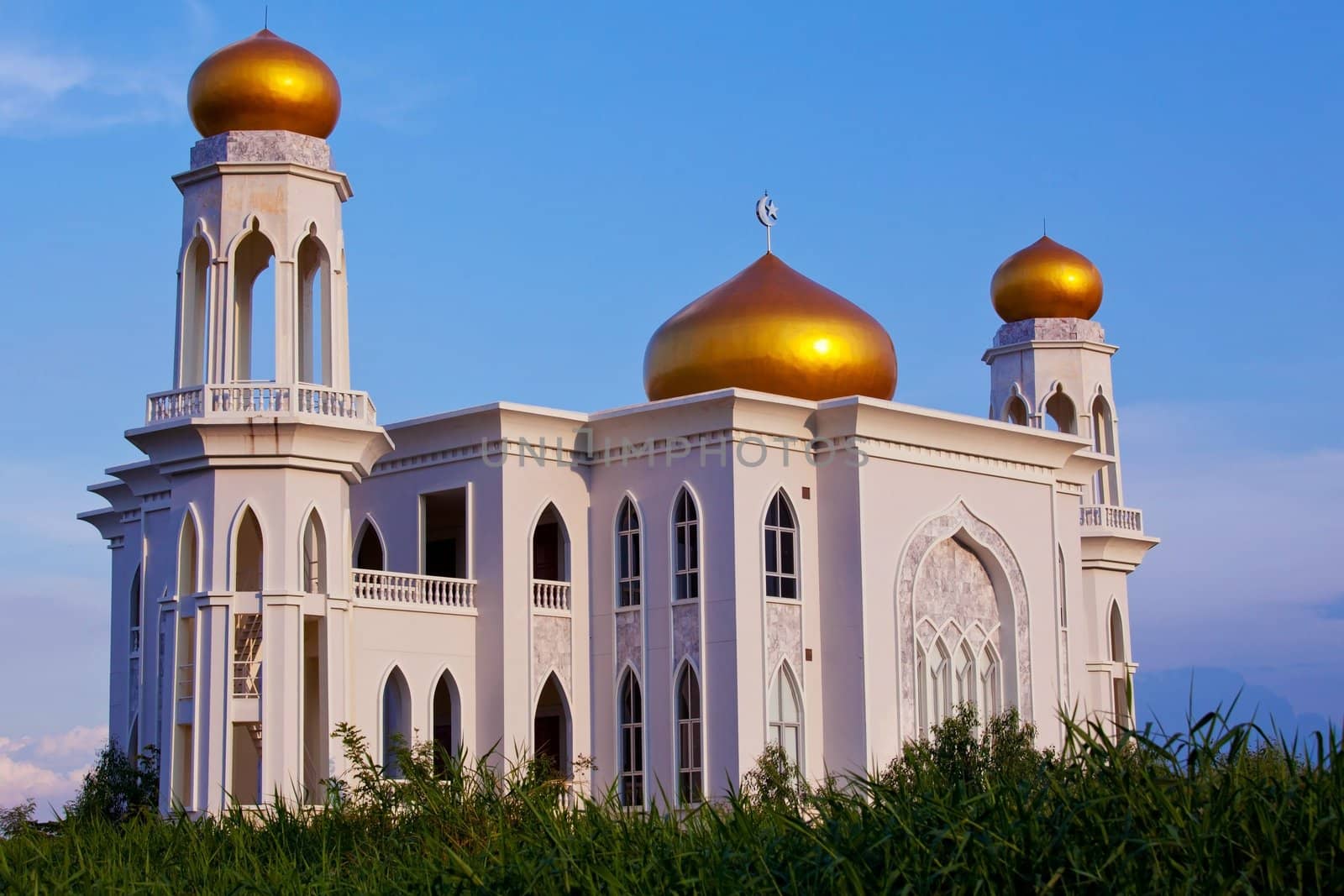 View of islamic mosque on sunset