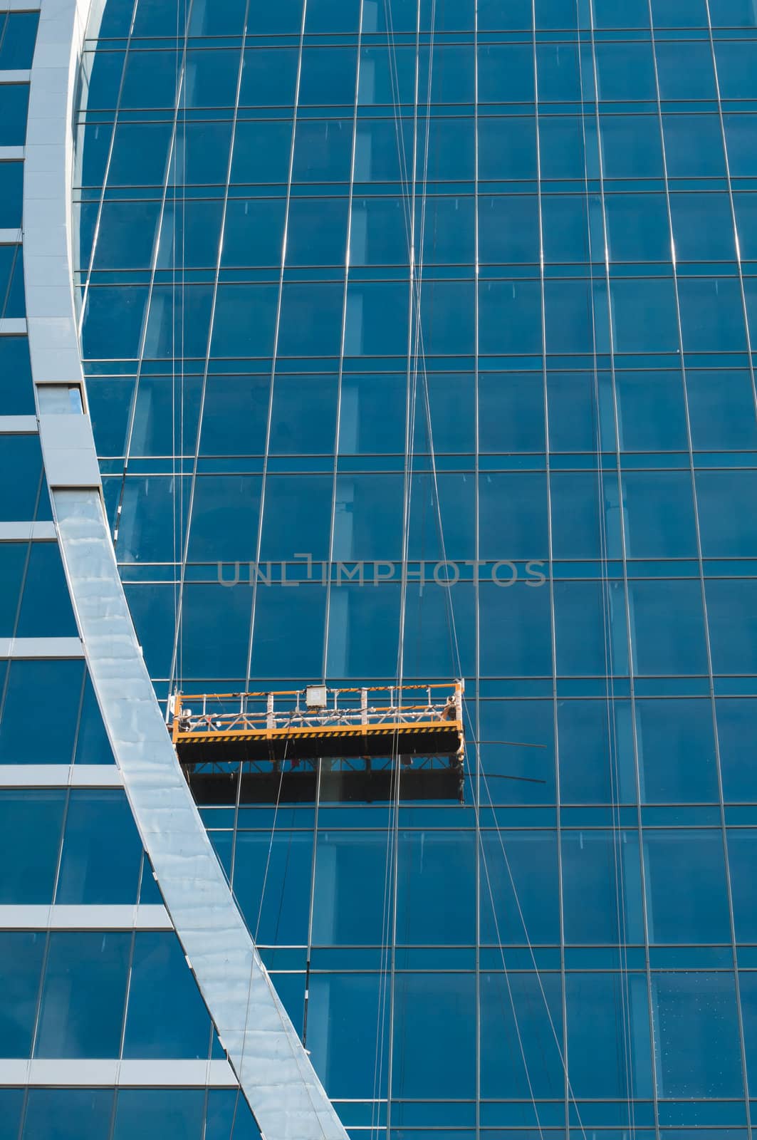 The glass wall of office building by nvelichko