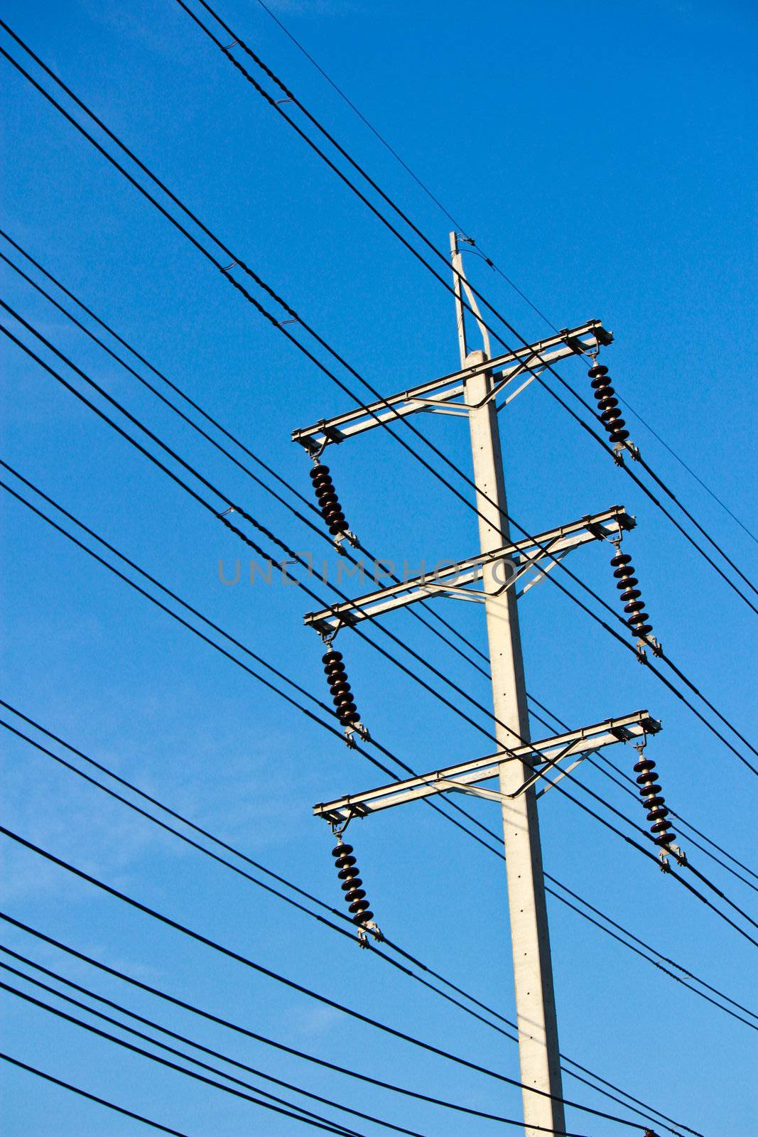 electricity post in blue sky