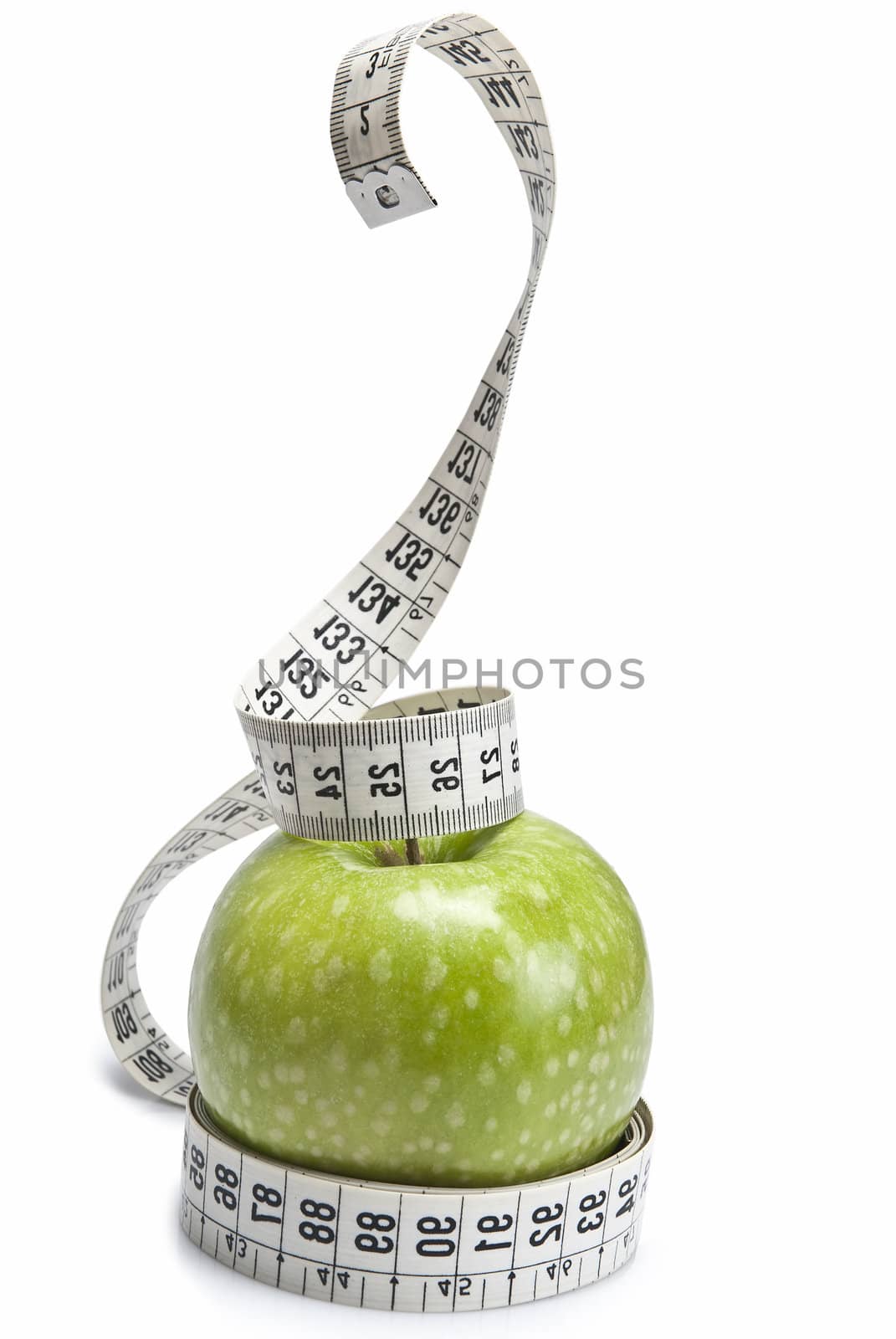 Tape measure simulating a snake wrapped around an apple.