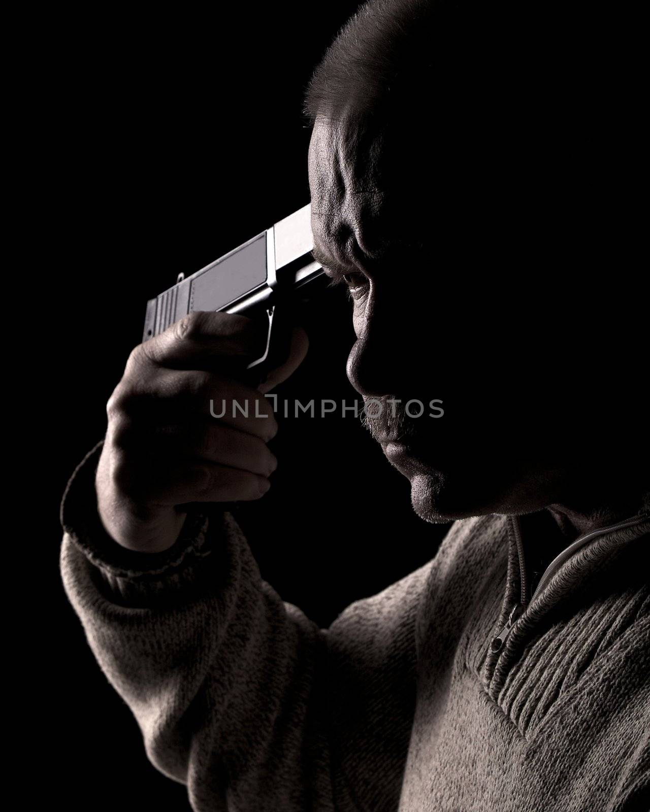 Man holding gun to his head