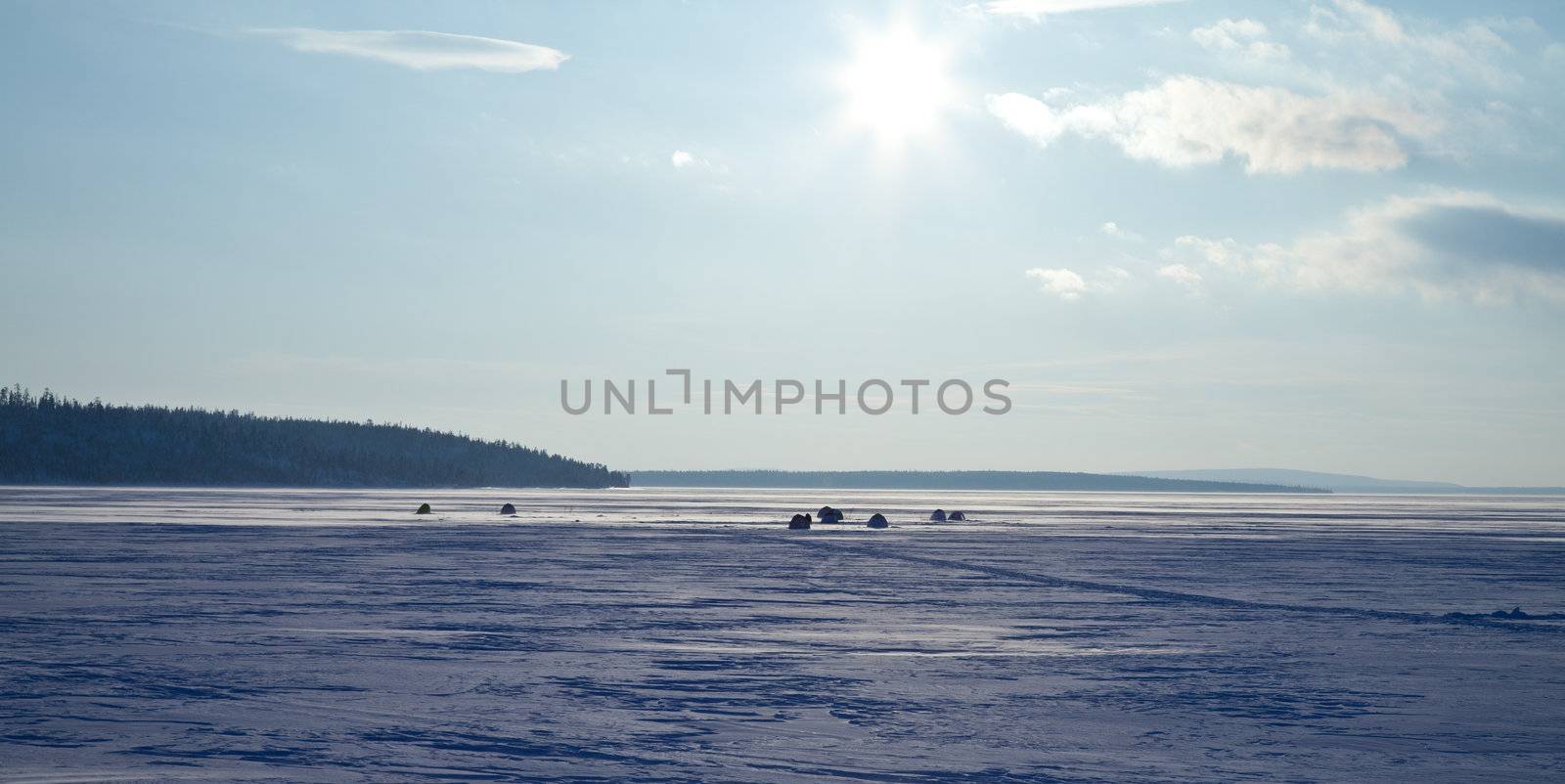 sun above frozen lake by Discovod