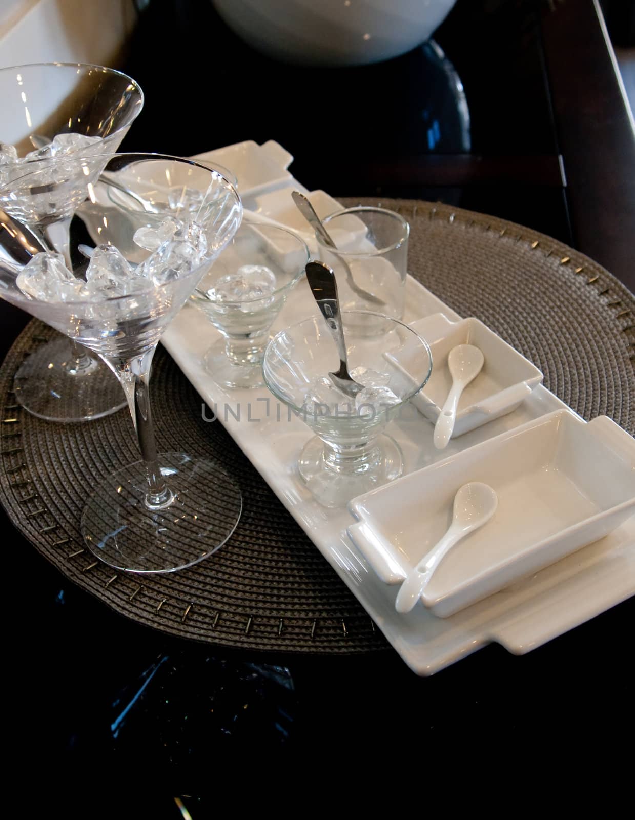 Martini service dishes on a woven place mat.